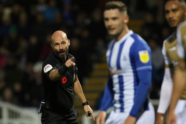 Referee, Darren Drysdale, interacts with Luke Molyneux of Hartlepool United during the FA Cup match between Hartlepool United and Wycombe Wanderers at Victoria Park, Hartlepool on Saturday 6th November 2021. (Credit: Will Matthews | MI News)