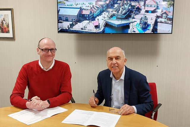 Councillor Shane Moore (left) and Stuart Monk sign the Memorandum of Understanding.
