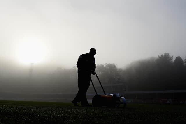 A groundsman cuts the grass at the Crabble Athletic Ground, Dover.  (Photo by Michael Regan/Getty Images)