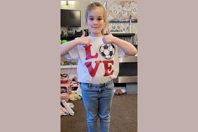 Chloe, age 6, shows her support for England.