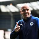 Paul Cook is close to keeping Wigan Athletic in the Championship despite a 12-point penalty.