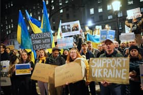 People take part in a demonstration on Whitehall, near to the entrance to Downing Street, London, following the Russian invasion of Ukraine. Picture PA.