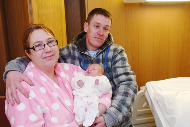 Lisa Burnett and Darren Pounder pictured alongside baby Olivia in 2010.