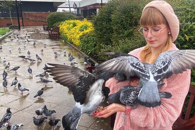 Margareta Akermark with Pigeons in Victory Square. Picture by FRANK REID