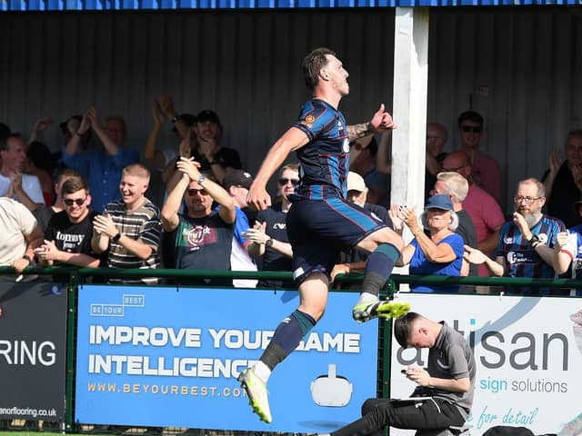 Callum Cooke celebrates with Hartlepool United fans after scoring at Oxford City earlier this season.