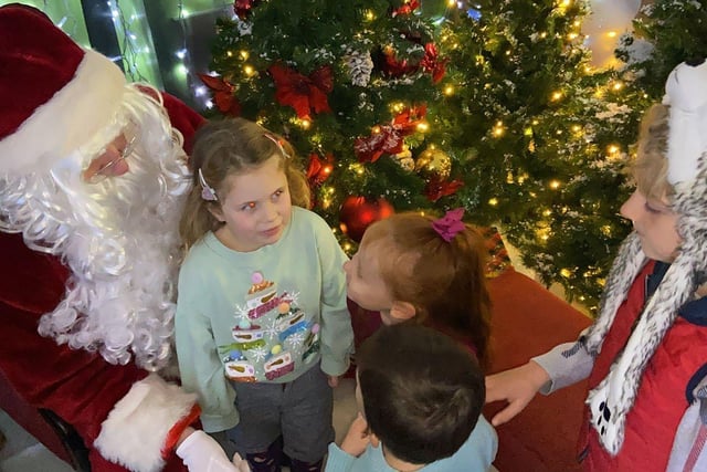 Children Samuel, Marshall, Ariella and Cara share their wishes with Santa after his arrival at Middleton Grange Shopping Centre. Picture by FRANK REID