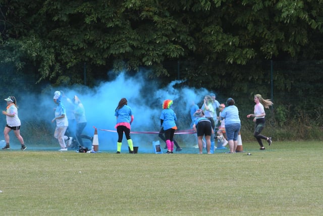Volunteers bombard runners with dye