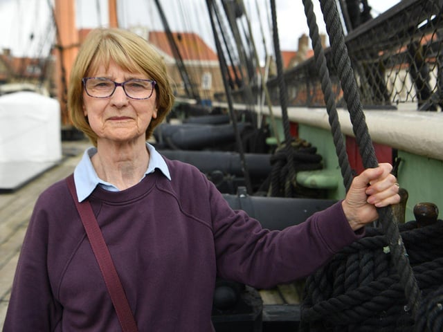 Muriel Carless steps aboard the HMS Trincomalee.