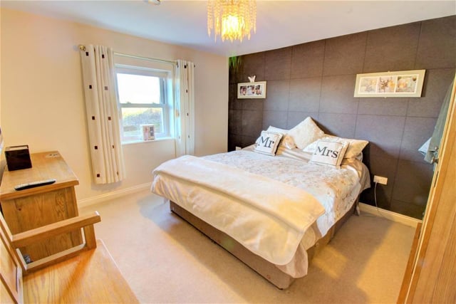 The master bedroom is a sizeable space with a lovely view via its window to the rear.