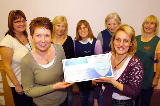 A Dyke House donation to help charity 16 years ago. Were you one of the people in the picture?