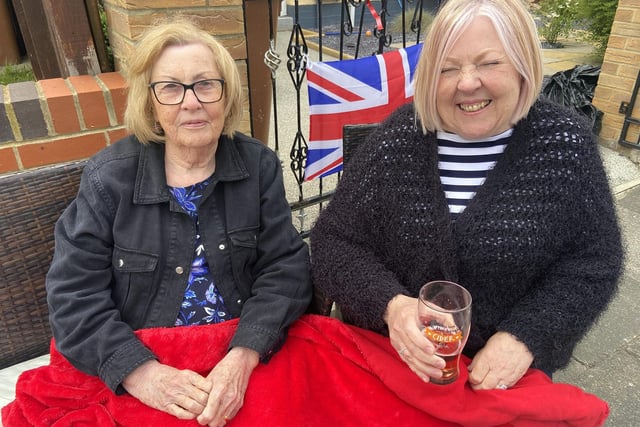 Liz Wood (left) and Jane Harrison keeping warm during the Jubilee Party at Lanark Road, Hartlepool. Picture by FRANK REID