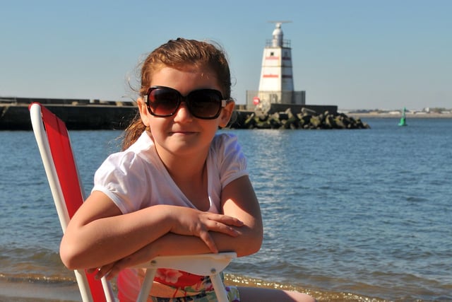 Laymiah Renney, six, relaxing in the sun at Fish Sands in 2012.