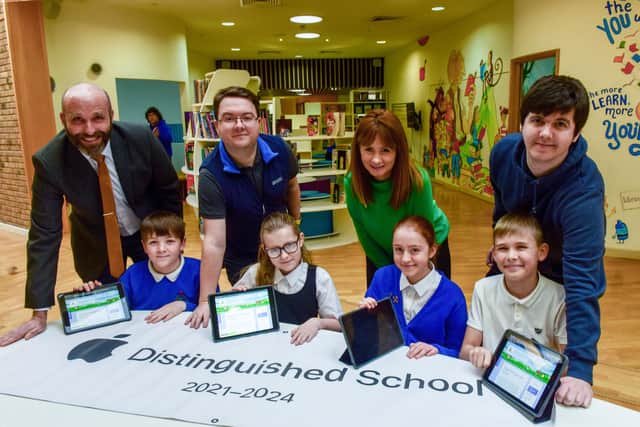 From left: headteacher Phil Pritchard, technology and innovation lead Simon Curtin, deputy headteacher Rebecca Nicholson and IT technician Josh Brown with pupils (left to right) Noah Turnbull, Nicola Wallace, Macey Woodhall and Elijah Wilson.