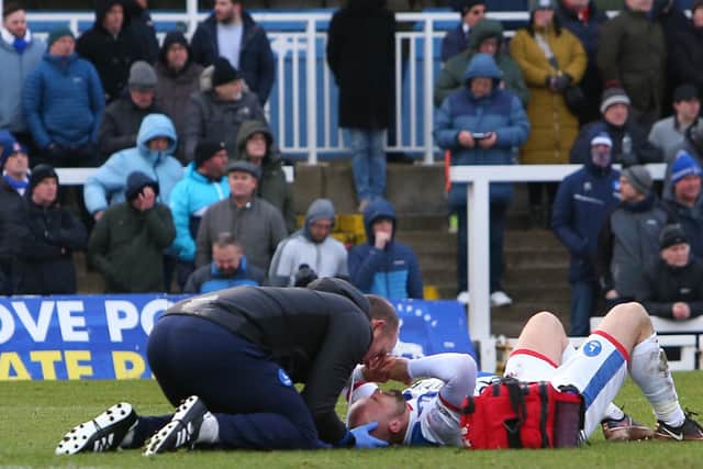 Peter Hartley undergoes treatment during Hartlepool United's 3-3 draw with Walsall. (Photo: Michael Driver | MI News)