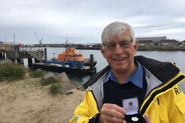 Hartlepool RNLI chairman Malcolm Cook pictured with his long service award. Picture by Tom Collins/RNLI