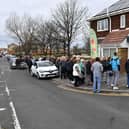 A queue of people outside Verrills fish and chip shop, on the Headland, in 2023.