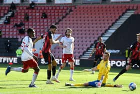 Dominic Solanke of AFC Bournemouth scores his side's third goal past Marcus Bettinelli of Middlesbrough.