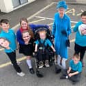 Springwell School pupils (in light blue shirts) Jaxon Pragnell, Eppy Bates, Harrison Winship and Leone Thomas along with Throston Primary School Head Girl Angela Hanlon and Head Boy Jack Bolton pose with cardboard cutouts of The Royal Family ahead of the parade./Photo: Frank Reid
