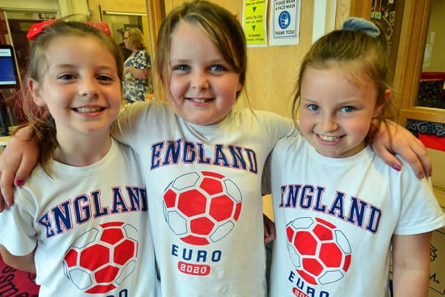 Rossmere Primary School pupils (left to right) Dasiy Dunnett, Libbie-Mae Crannage and Darcie Moore in their England shirts.