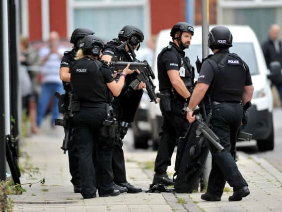 Armed police in St Oswald's Street.