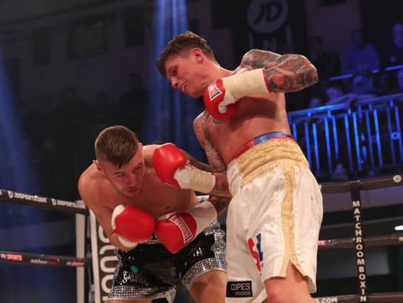 Peter Cope (right) lands a right against Paul Hyland jr. Picture by LAWRENCE LUSTIG/ MATCHROOM BOXING