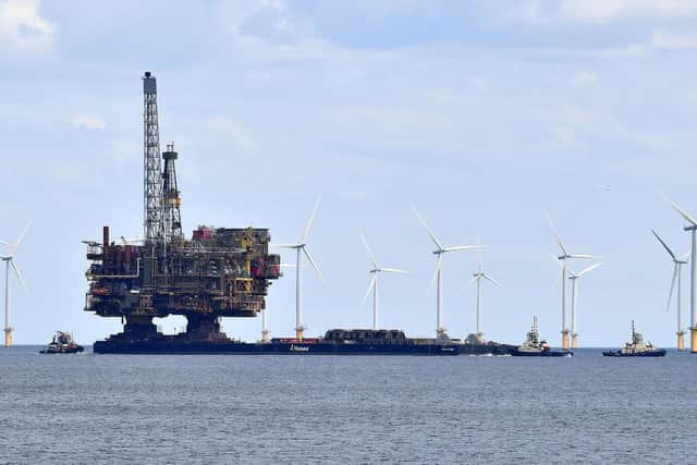 The Brent Bravo Oil Platform as it passes the Wind Turbines, Seaton Carew, Hartlepool. Picture by FRANK REID