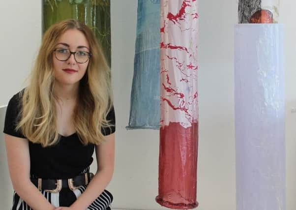 Aimee Monkman with her collection of textile-based artwork which will be on display at the degree show.