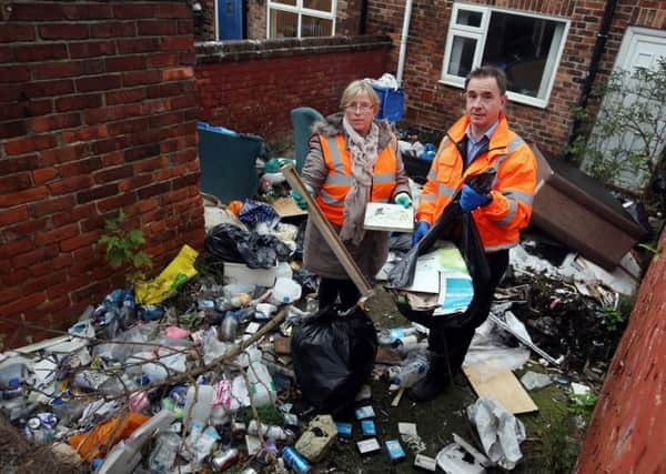 Oliver Sherratt, head of direct services and Coun June Clark taking part in a clean-up in Horden last year.