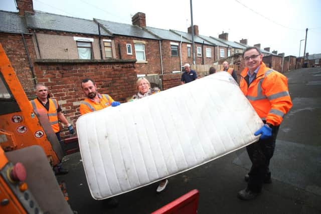 Oliver Sherratt, head of direct services and Coun June Clark taking part in a clean-up in Horden last year.
