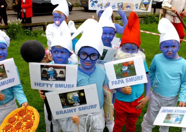 Smurfs in the fancy dress parade at the 2012 Greatham Feast.