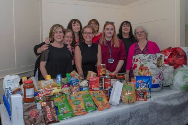 Reverend Gemma Sampson with St Aidan's kitchen project volunteers at the fundraising event. Picture Ashley Foster