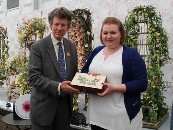 Rebecca Hough being presented with her award. Photo courtesy of floral.co.uk