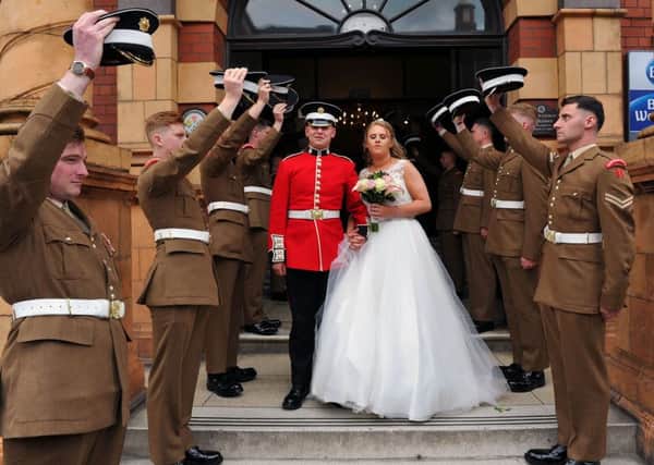 Danielle Harrison and Coldstream Guardsman Josh Obeirne are given a Guard of Honour by fellow Coldstream Guardsmen after their wedding at the Grand Hotel, Hartlepool Picture by FRANK REID