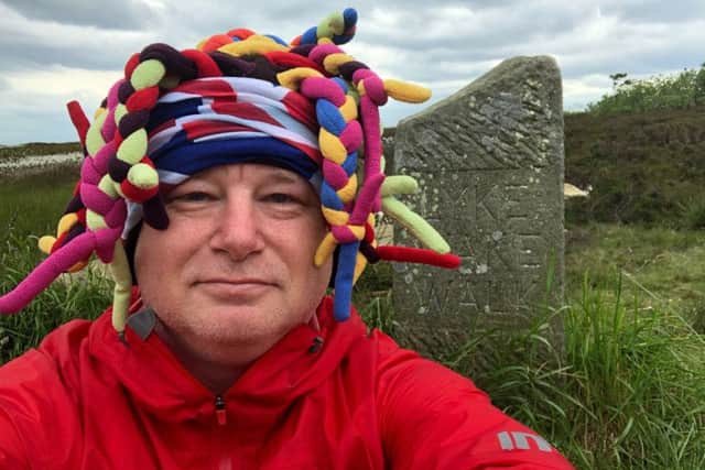 A very tired Paul Suggitt at Ravenscar after completing the 40-mile walk in  17 hours.