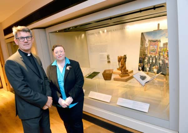 Miners: Pitmen, Pride and Prayer exhibition in Open Treasure at Durham Cathedral. The Very Reverend Andrew Tremlett, Dean of Durham with Marie-Therese Mayne, Exhibitions Officer, Durham Cathedral and curator of the exhibition