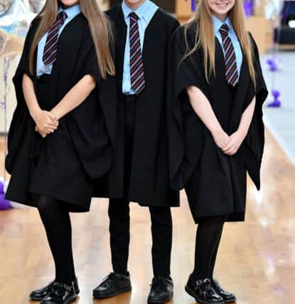 Layla Fitzgerald, Owen clapham and Ellie Marshall after their graduation.