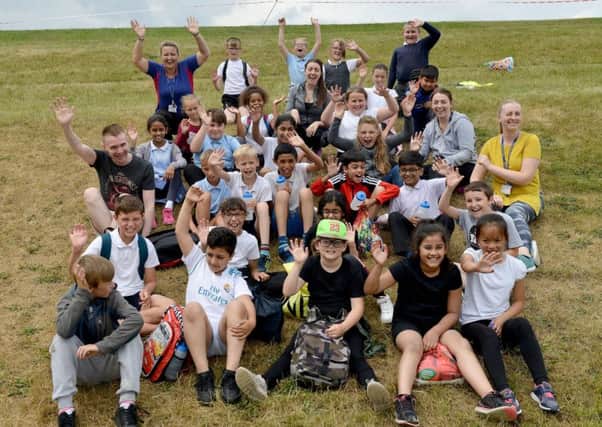 Staff and pupils from, Lynnfield Primary School cheering on pupils from High Tunstall College of Science  as they complete in the muddy challenge event. Picture by Frank Reid