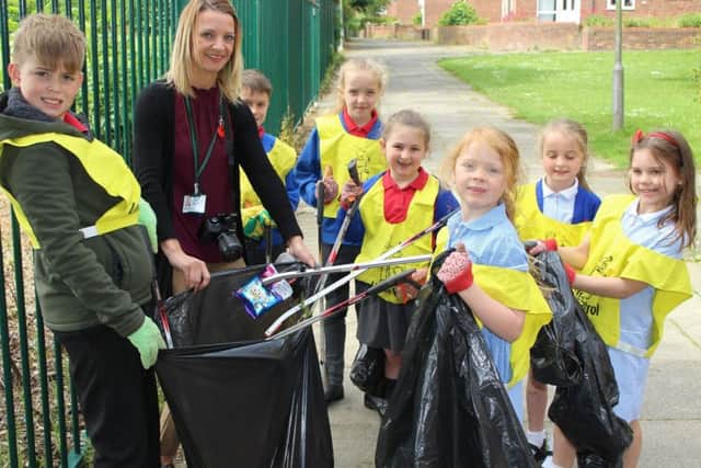 Members of Throston Primary Schools Eco-Club take part in the litter pick with teacher Abby Davies.