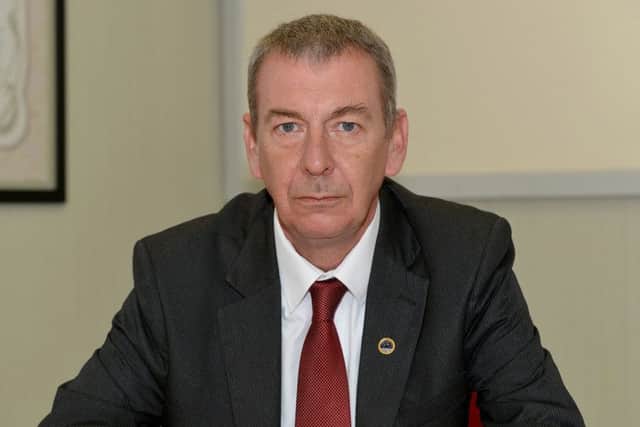 Hartlepool MP Mike Hill says police budget cuts are linked to rises in crime.
