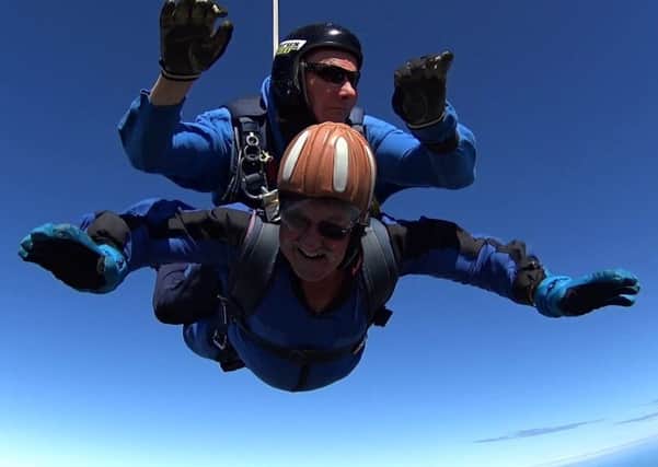 Wally Stewart doing the tandem skydive that was a present for his 76th birthday.