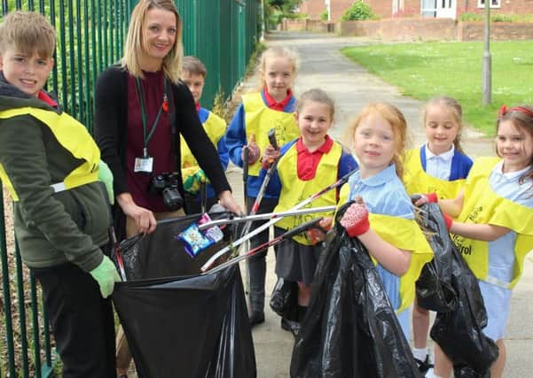 Members of Throston Primary Schools Eco-Club take part in the litter pick with teacher Abby Davies.