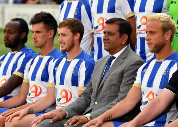Hartlepool United chairman Raj Singh sits in for the official Hartlepool United team photo.  Picture by Frank Reid
