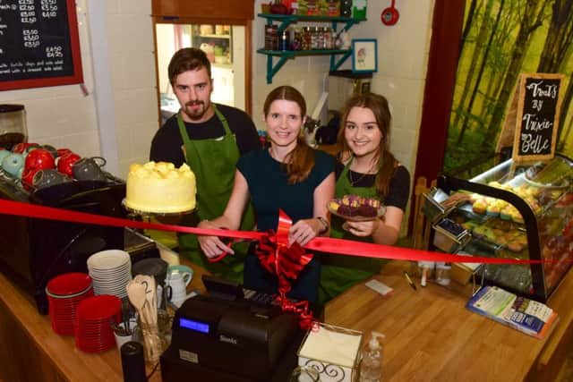 Cutting the ribbon to officially open the new cafe at Summerhill Country Park, on Wednesday, by Jill Harrison (centre) Director of Adult & Community Services, Hartlepool Borough Council, helped by cafe staff Robert Leighton (left) and Faith Featherstone (right).