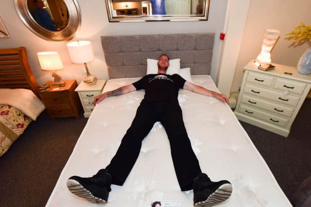 Britain's tallest man Paul Sturgess called in at Rafferty's in York Road, Hartlepool, to pick up the new bed they had made for him.