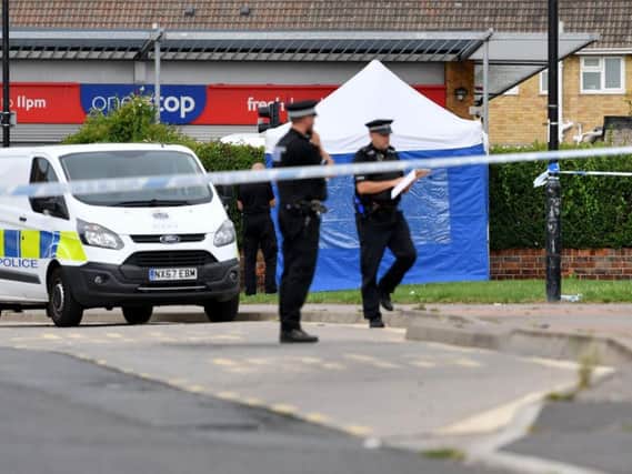 Police at the murder scene in Oxford Road