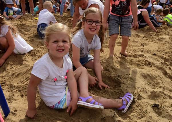 Annual Hartlepool Carnival Treasure Hunt on Fish sands, Headland, Hartlepool, on Monday. Ava (6) and Phoebe (3) Howe digging for the treasure