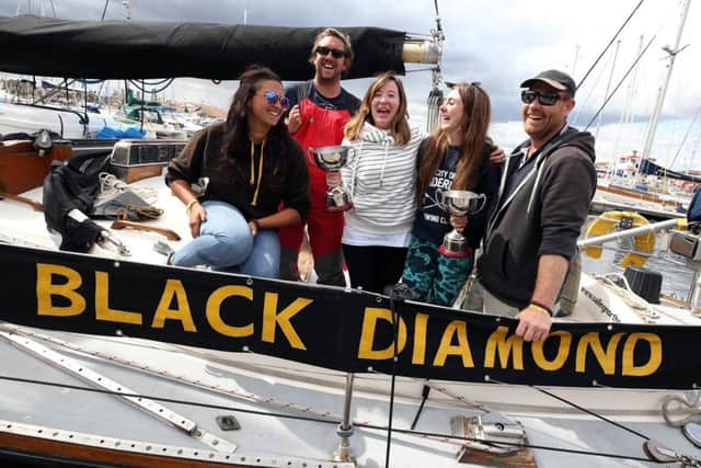 The Black Diamond of Durham return to Hartlepool Marina after recording its best ever performance in the Tall Ships Race. Five of the eight crew members, Jessica Clarke, Micky Early, Rachel Rattigan, Daynor Guerin and skipper Calvyn Whitehand. Picture: CHRIS BOOTH
