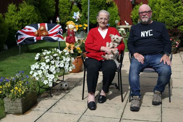 Judging of the best dressed garden, house and business takes place on Hartlepool Headland. Mary Price, Alfie Price and their dog Jess at their home on Northgate. Picture: CHRIS BOOTH