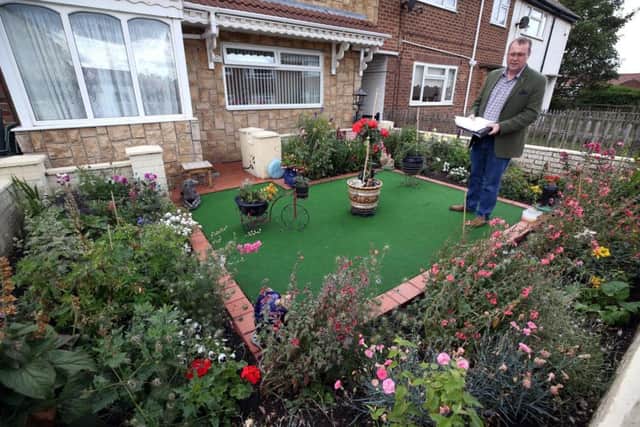Judging of the best dressed garden, house and business takes place on Hartlepool Headland. Mary Price, Judge Jason Anderson at a house on Frederic Street. Picture: CHRIS BOOTH