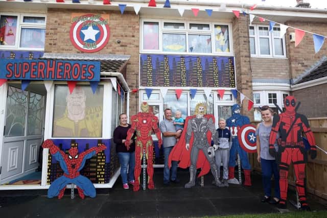 Judging of the best dressed garden, house and business takes place on Hartlepool Headland. At a house on Lumley Square are Bethany Sutheran, Peter Sutheran with Zack Dobson (2), Charlie Owens (11) and Lisa Sutheran witha Super Heroes-themed house. Picture: CHRIS BOOTH